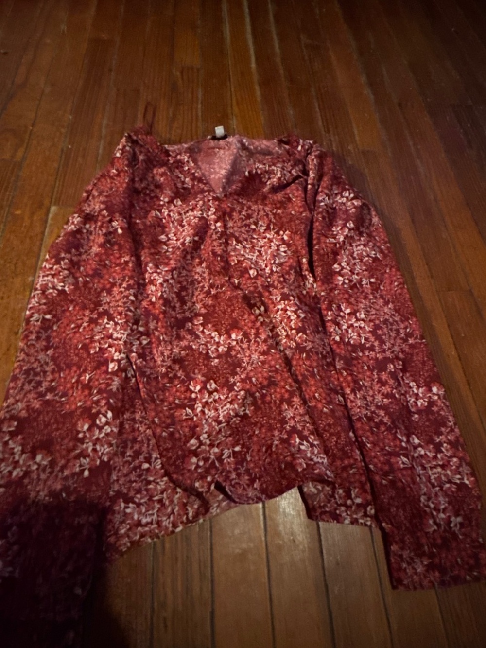 Soft red floral blouse with a subtle v-neck. Lightweight fabric and full sleeves